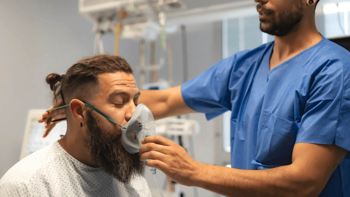person being helped breathing